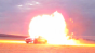 Car Driving Through Flame Burst Image